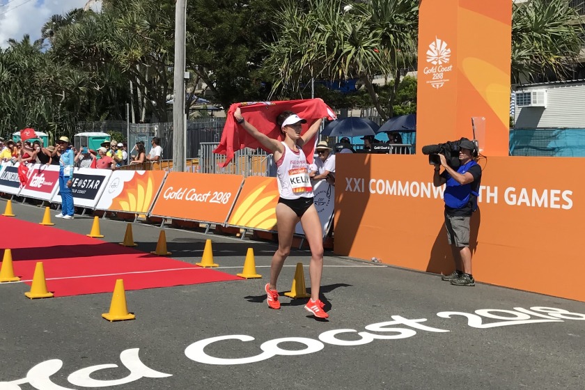 Erika Kelly crossing the finish line